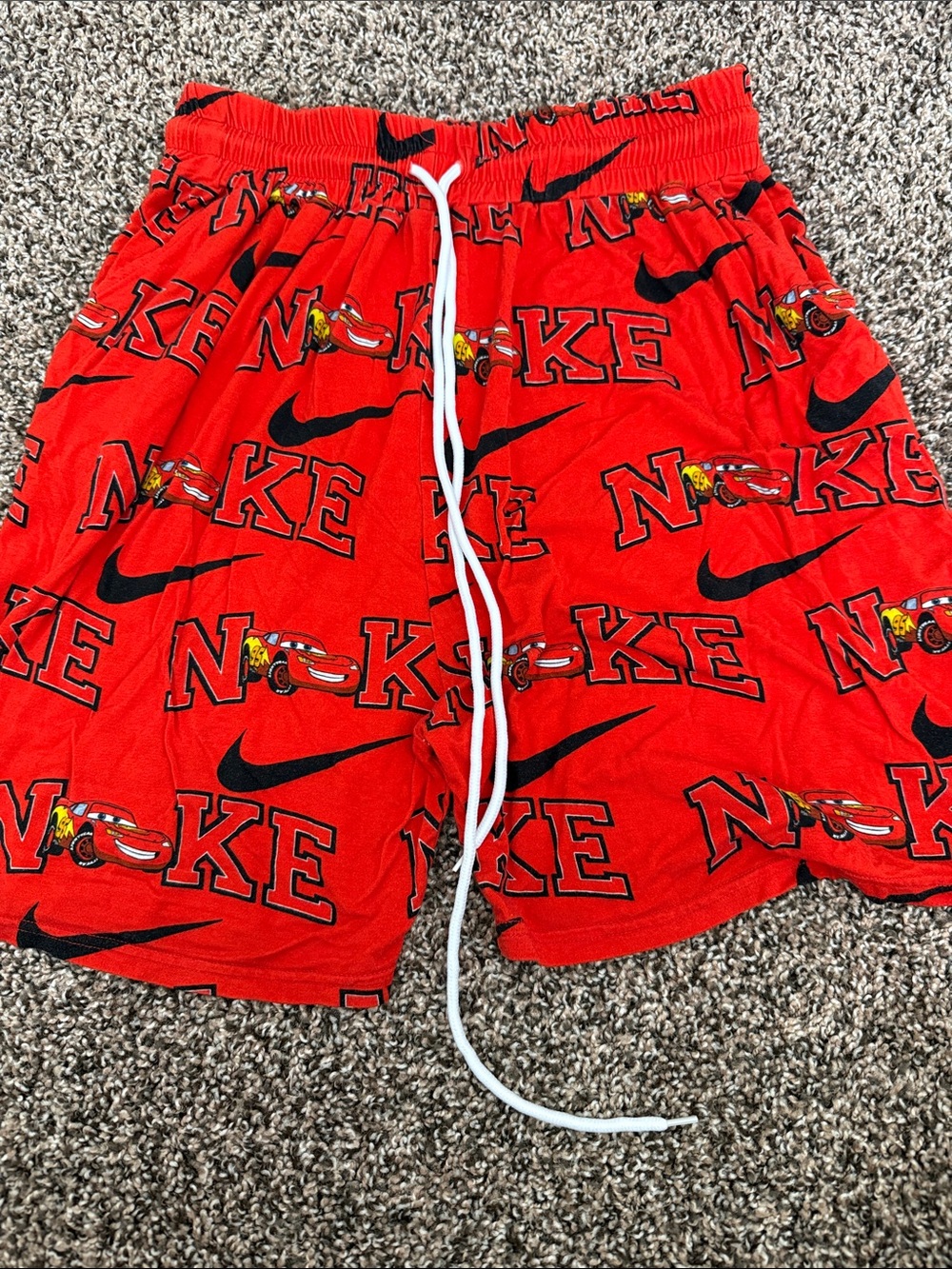 Nike Red Graphic Logo Bamboo Shorts with Black Swoosh